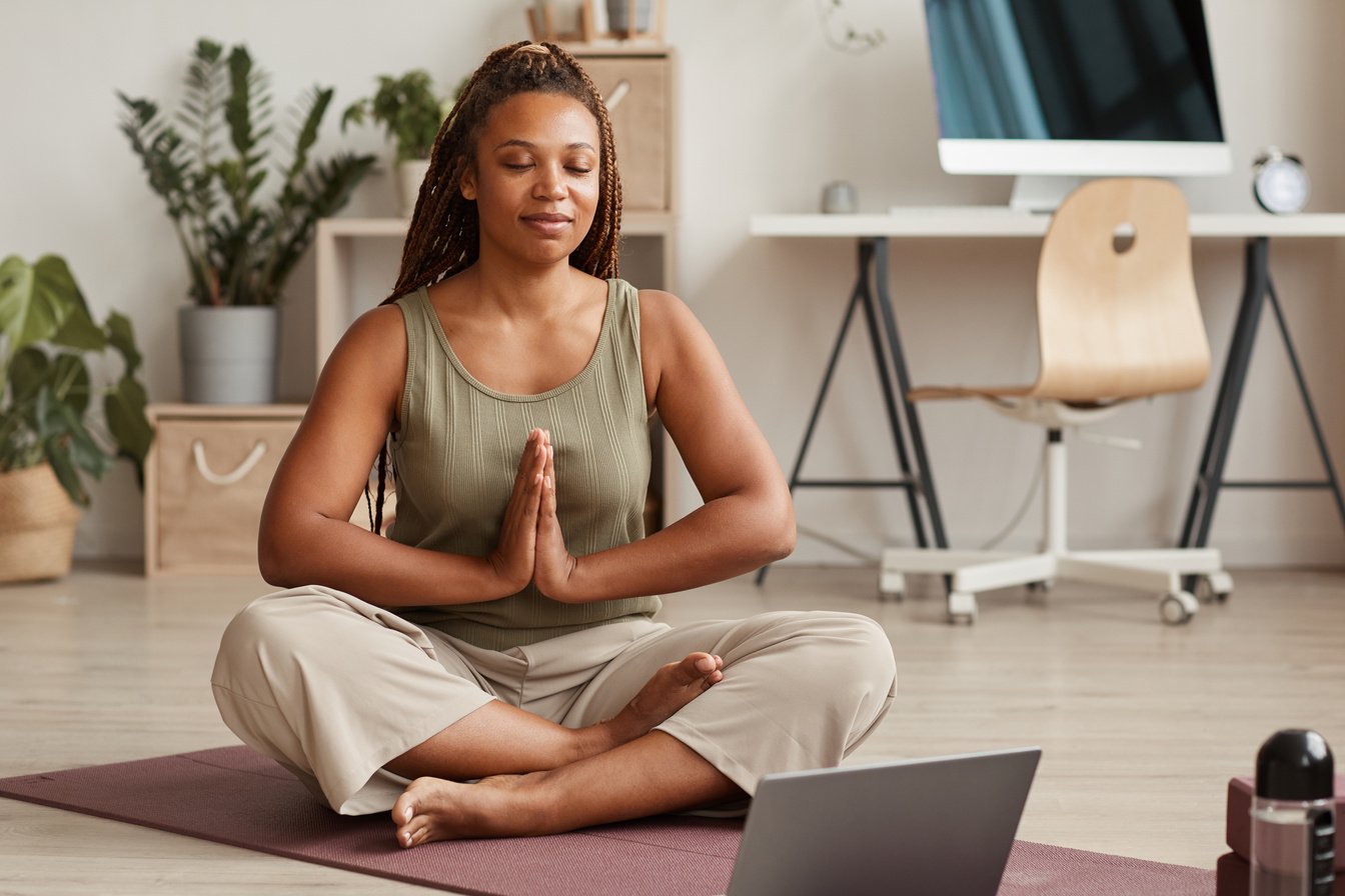 Woman meditating at home